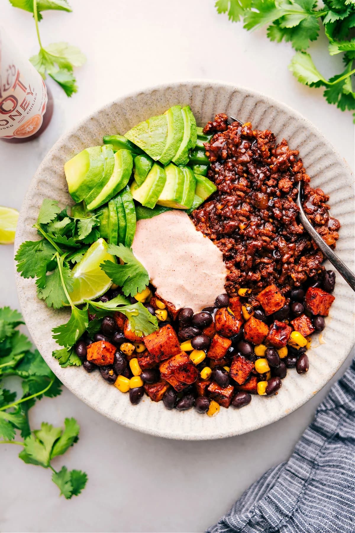 Ground Beef Taco Bowl with Crispy Sweet Potatoes and Creamy Lime Sauce